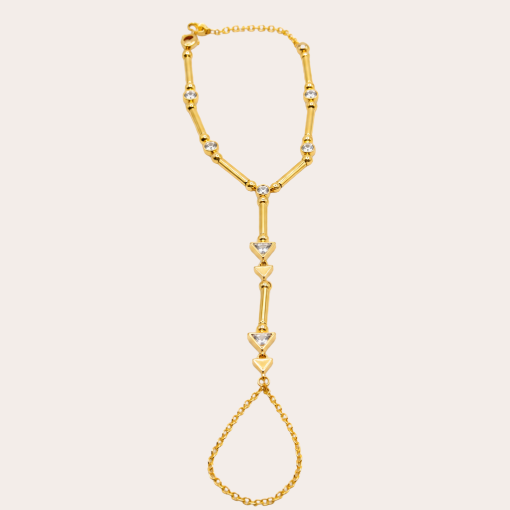 Golden hand chain with triangle crystals