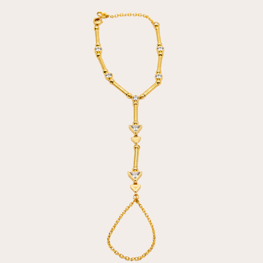 Golden hand chain with triangle crystals