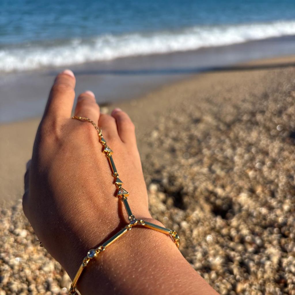 Golden hand chains with stones