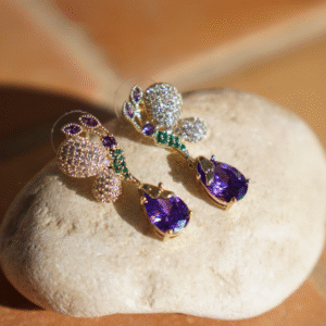 Vlinder oorbellen paarse steen